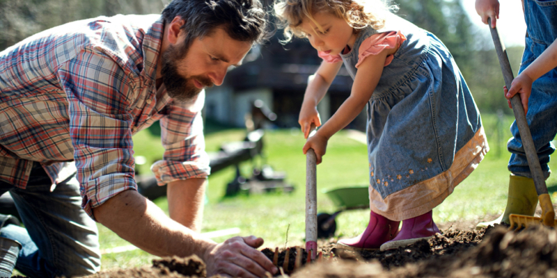 father and child gardening